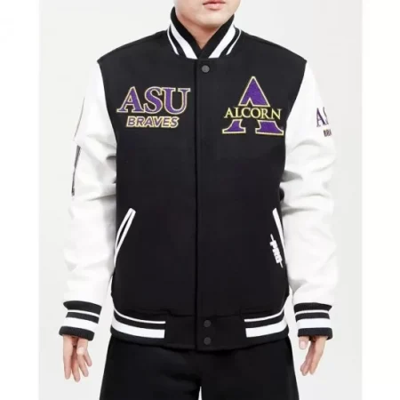 Model wearing Alcorn black and white varsity jacket front view