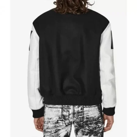 Model wearing Alyx black and white varsity jacket back view