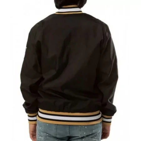 Model wearing Bomber New Orleans Saints Varsity Jacket back view