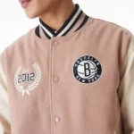 Model in Brooklyn Nets NBA Varsity Jacket, front view