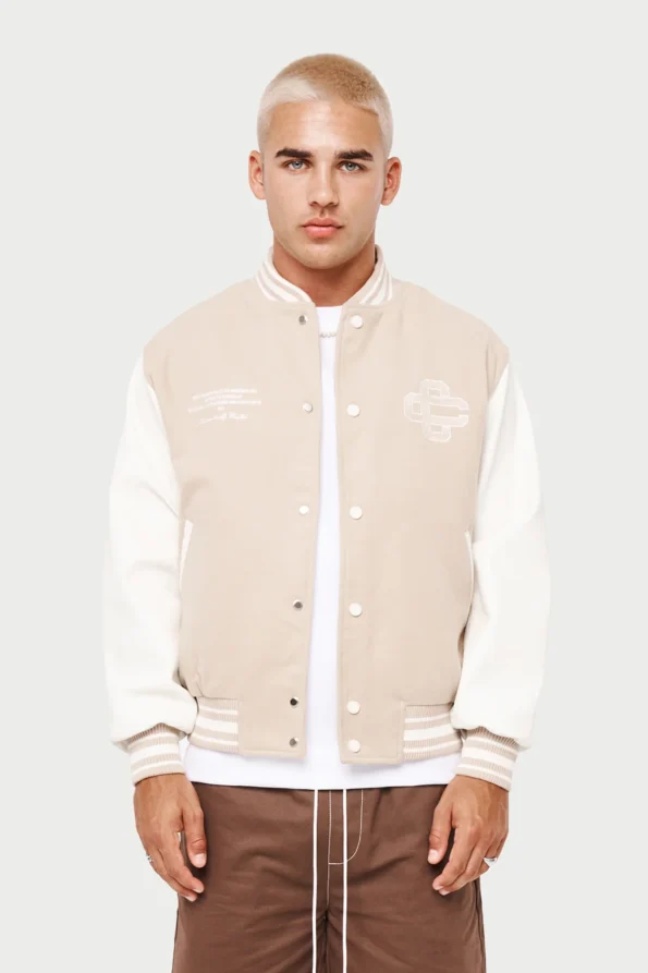 cream and white varsity jacket