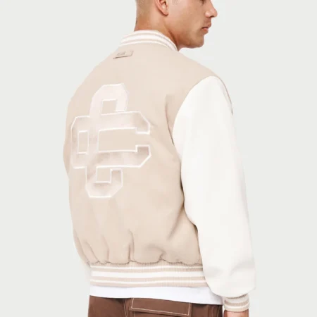 cream and white varsity jacket