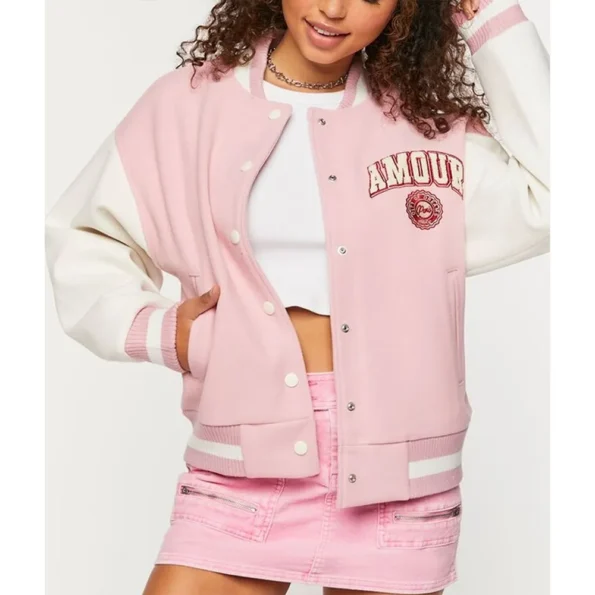 Model wearing Amour Paris Pink Varsity Jacket side.