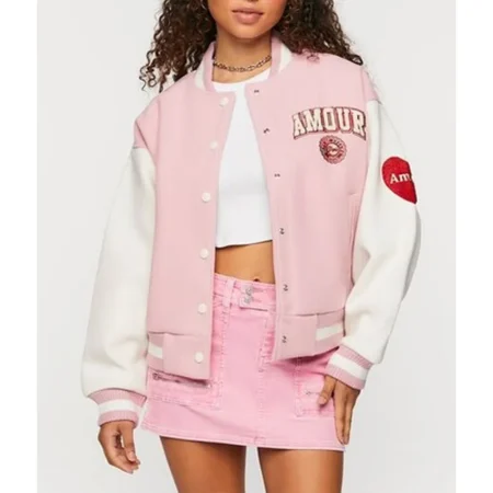 Model wearing Amour Paris Pink Varsity Jacket front.