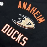 Model front view wearing Anaheim Ducks Tailback Varsity Jacket.