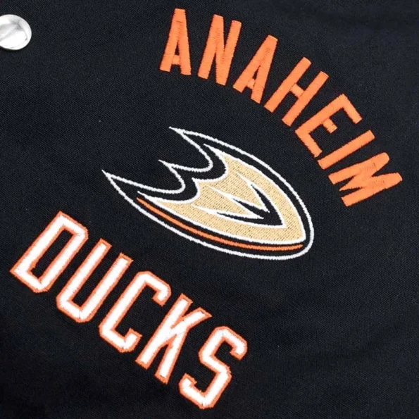 Close-up of Anaheim Ducks Tailback Varsity Jacket logo and fabric.