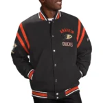 Model front view wearing Anaheim Ducks Tailback Varsity Jacket.