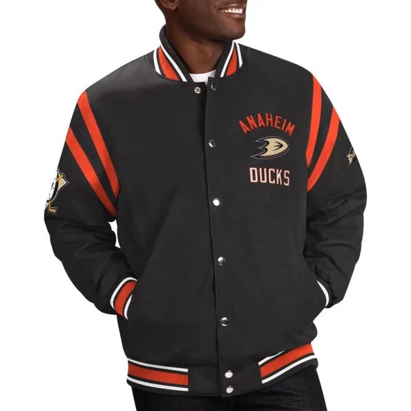 Model wearing Anaheim Ducks Tailback Varsity Jacket front view.