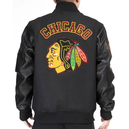 Model wearing Chicago Blackhawks Patches Varsity Jacket back view.