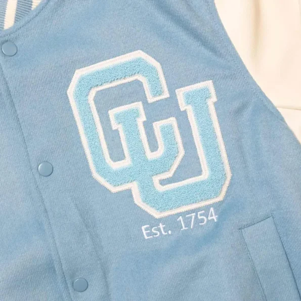 Close-up detail of Columbia University Blue Varsity Jacket logo