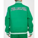 Model front view wearing Philadelphia Eagles Crest Varsity Jacket.