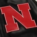 Model front view wearing Nebraska Cornhuskers Varsity Jacket.