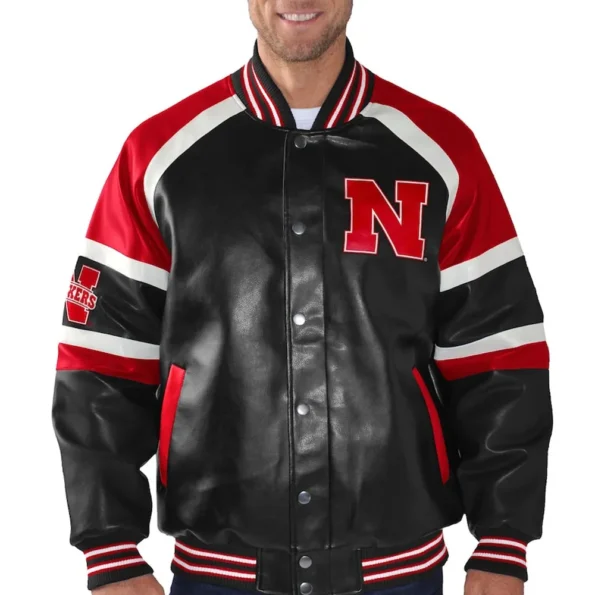 Model wearing Nebraska Cornhuskers Varsity Jacket front view.