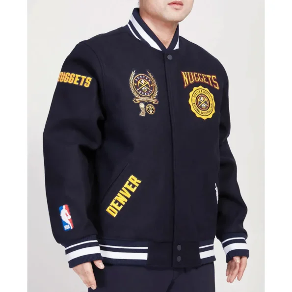 Side profile of model wearing Denver Nuggets Crest Varsity Jacket.