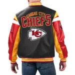 Model front view wearing Kansas City Chiefs Black Varsity Jacket.