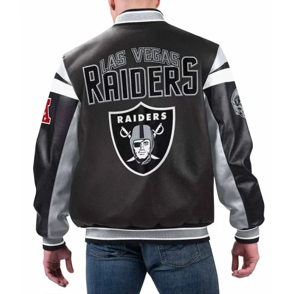 Model wearing Las Vegas Raiders Black Varsity Jacket back view.