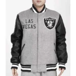 Model wearing Las Vegas Raiders Varsity Jacket front view.