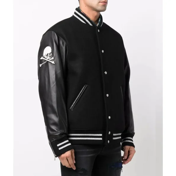 Model wearing Mastermind Japan Logo Varsity Jacket side.