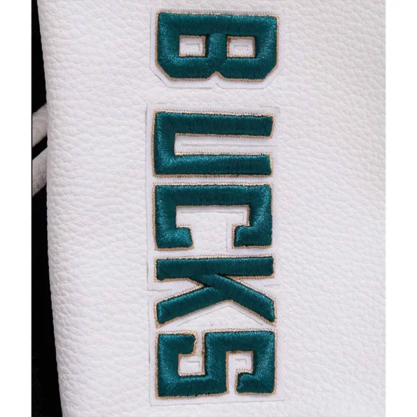 Close-up of Milwaukee Bucks varsity jacket fabric and embroidery.