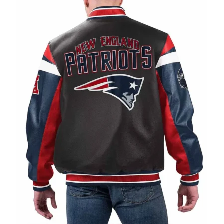 Model wearing New England Patriots Black Varsity Jacket back view.