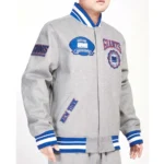 Model wearing NY Giants Crest Gray Varsity Jacket front view.