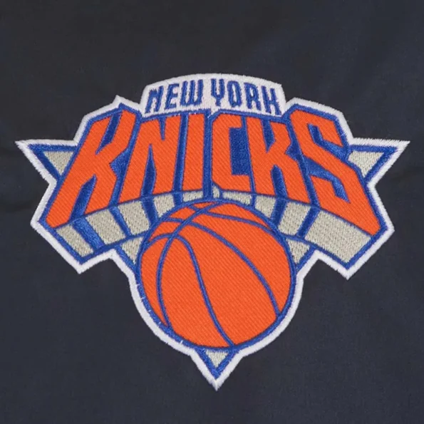 Close-up of NY Knicks Chenille Varsity Jacket logo detailing.