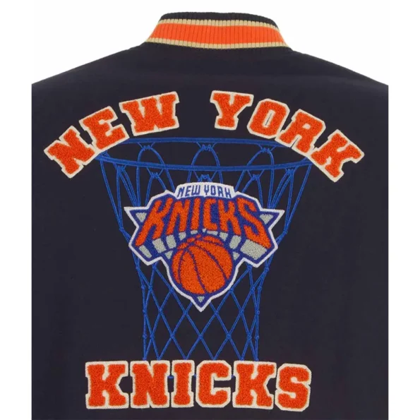 Close-up of NY Knicks Chenille Varsity Jacket logo detailing.