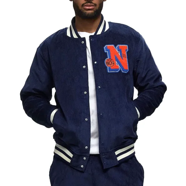 Model wearing NY Knicks Navy Corduroy Varsity Jacket front view.