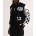 Model front view wearing Off-White Appliquéd Felt Varsity Jacket.