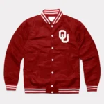 Model showcasing front view of Oklahoma Boomer Sooners varsity jacket.