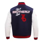 Front design of Philadelphia 76ers City of Varsity Jacket showcasing logo.