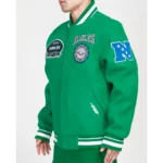 Model front view wearing Philadelphia Eagles Crest Varsity Jacket.