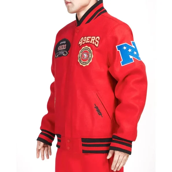 Model wearing San Francisco 49ers Crest Varsity Jacket side view.