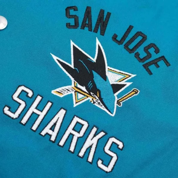 Close-up of San Jose Sharks Tailback Varsity Jacket logo and fabric.