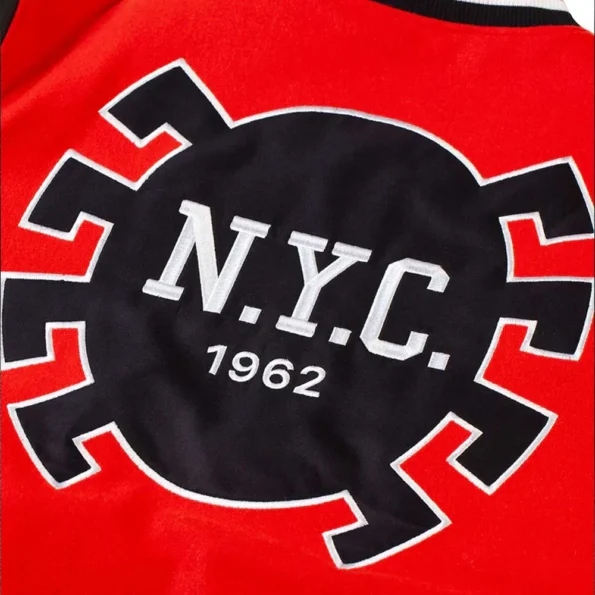 Close-up of Spider-Man NYC 1962 Varsity Jacket logo and fabric.