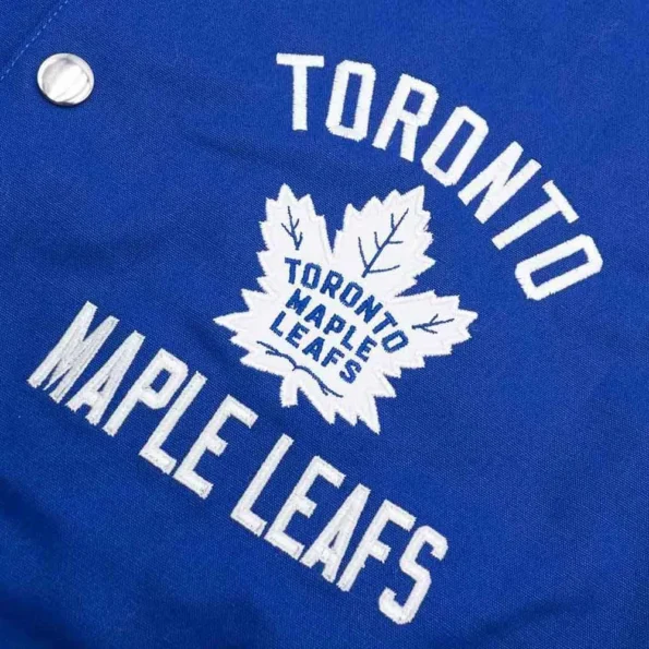 Close-up of Toronto Maple Leafs Varsity Jacket logo and fabric.