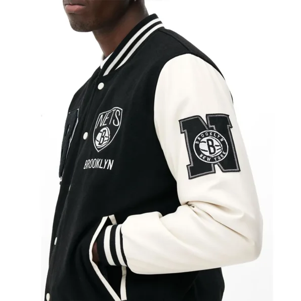 Close-up of Brooklyn Nets Varsity Black Jacket details