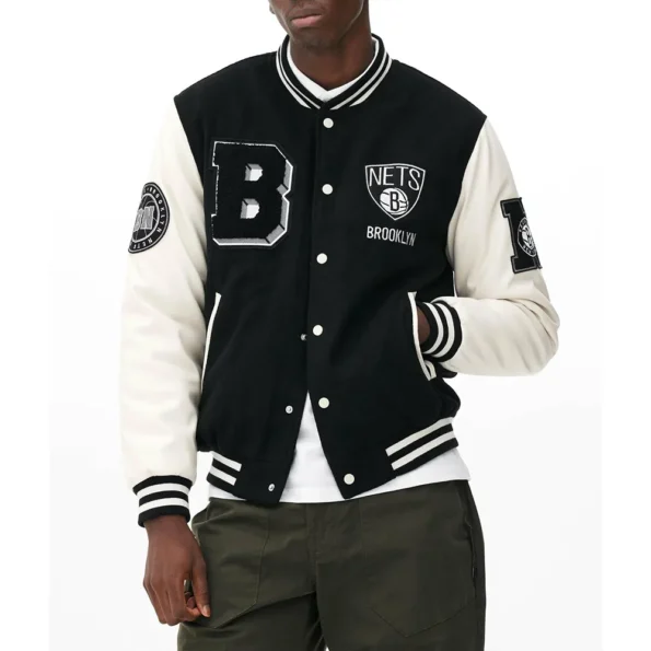 Model wearing Brooklyn Nets Varsity Black Jacket front