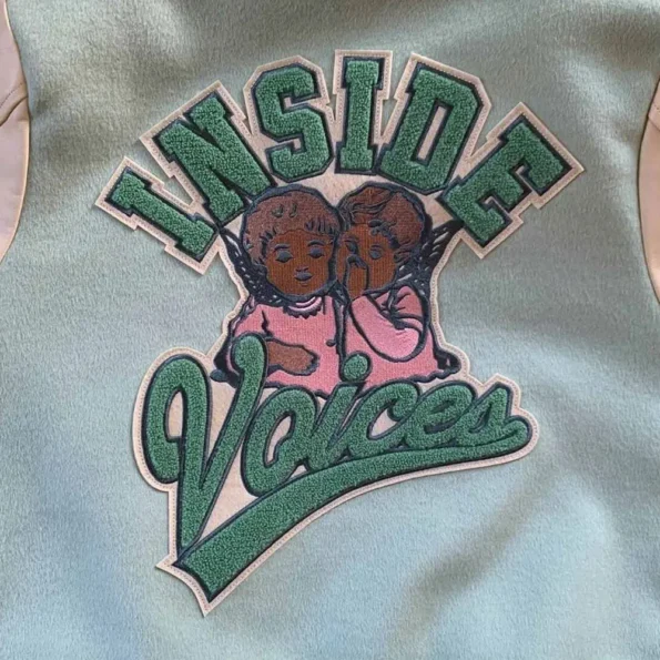 Close-up of Inside Voices Varsity Jacket details