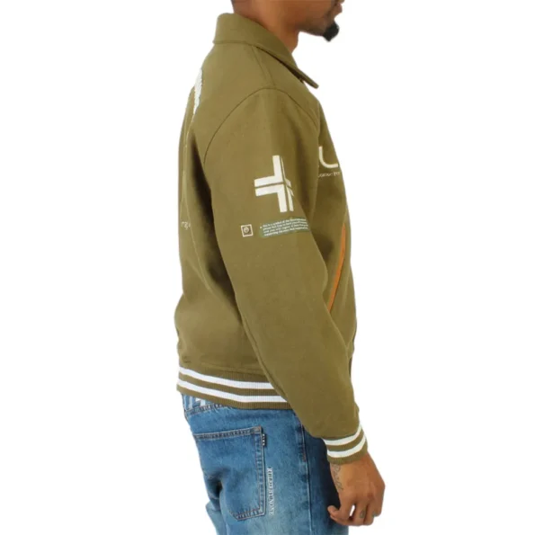 Side view of model in LRG Team Player Varsity Jacket