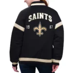 Model in New Orleans Saints Black Varsity Jacket Front