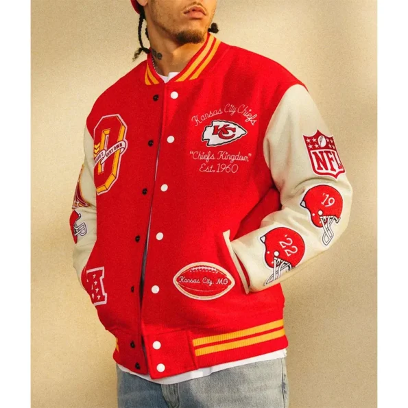 Side view of model wearing OVO Kansas City Chiefs Varsity Jacket