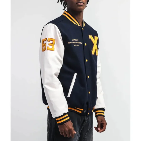 Side view of model in Xavier Institute Black Varsity Jacket