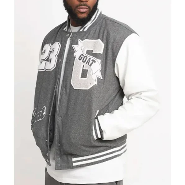 Side view of model in Goat 23 Varsity Jacket