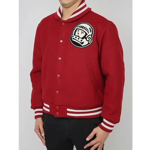 Side view of model in Astro BBC Burgundy Varsity Jacket