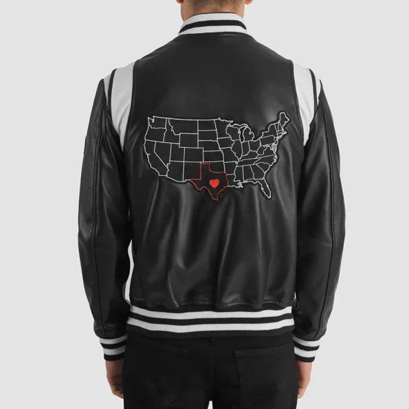 The model showcases the stylish front design of the Liberte Texas Black Varsity Jacket.