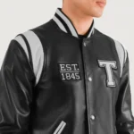 Model in Liberte Texas Black Varsity Jacket Fron