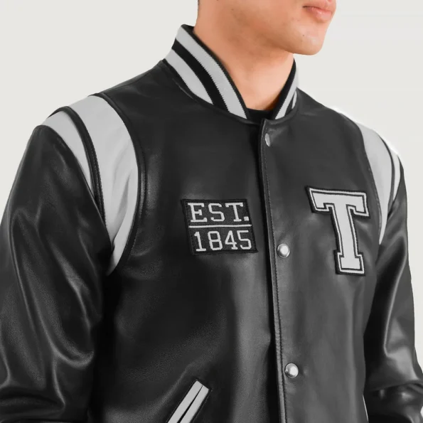 Close-up of Liberte Texas Black Varsity Jacket details