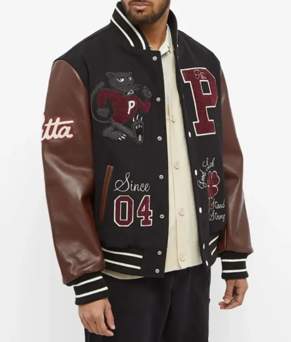 Model wearing Lucky Charm Patta Varsity Jacket front view