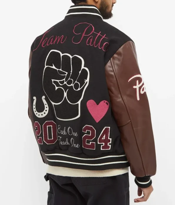 Side view of model in Lucky Charm Patta Varsity Jacket